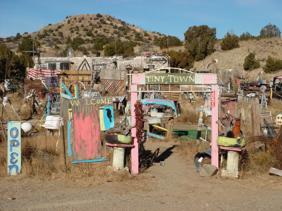Tiny Town on Highway 14, and one of its dollhouses, with a resident cat.