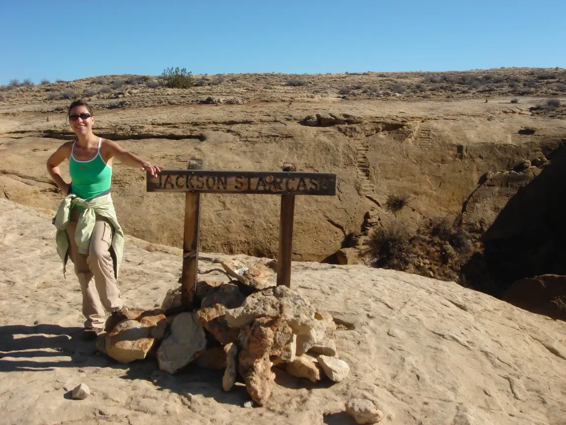 Jess at the Jackson Staircase, and me wedged in the crack at the start of the Pueblo Alto trail.