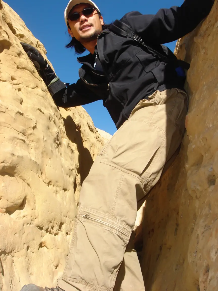 Jess at the Jackson Staircase, and me wedged in the crack at the start of the Pueblo Alto trail.