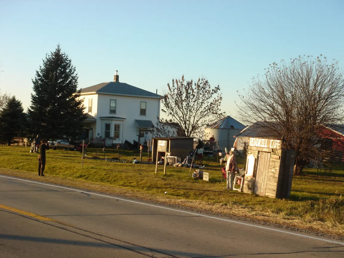 The Sprinter by a harvested cornfield outside Ohio, Illinois, and the Halloween display down the road.