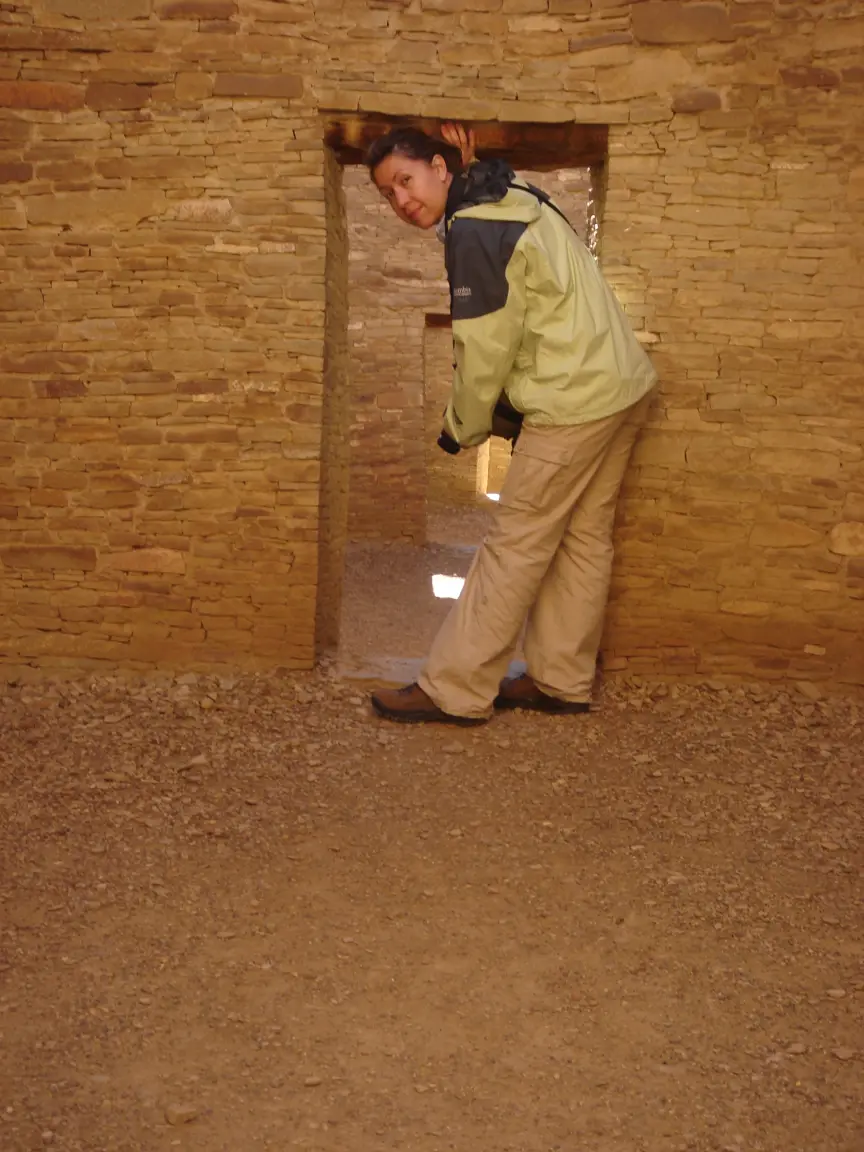 Jess in the doorways of Pueblo Bonito, one room deeper at a time.