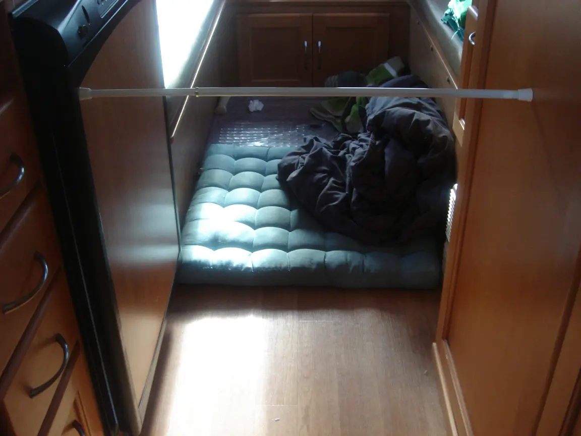 The van the day we brought it back: Simon's spot between the seats, the galley, the drawers, and every cabinet we learned to latch.