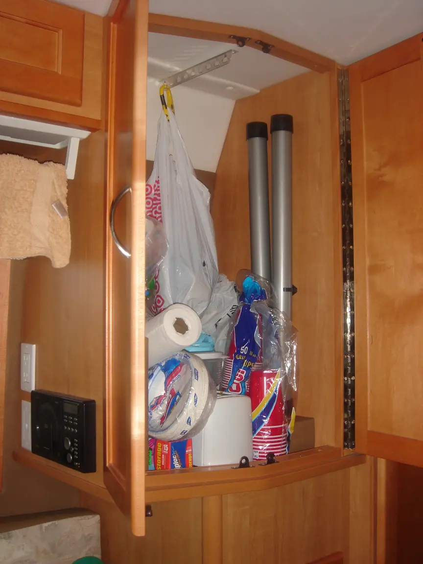 The van the day we brought it back: Simon's spot between the seats, the galley, the drawers, and every cabinet we learned to latch.
