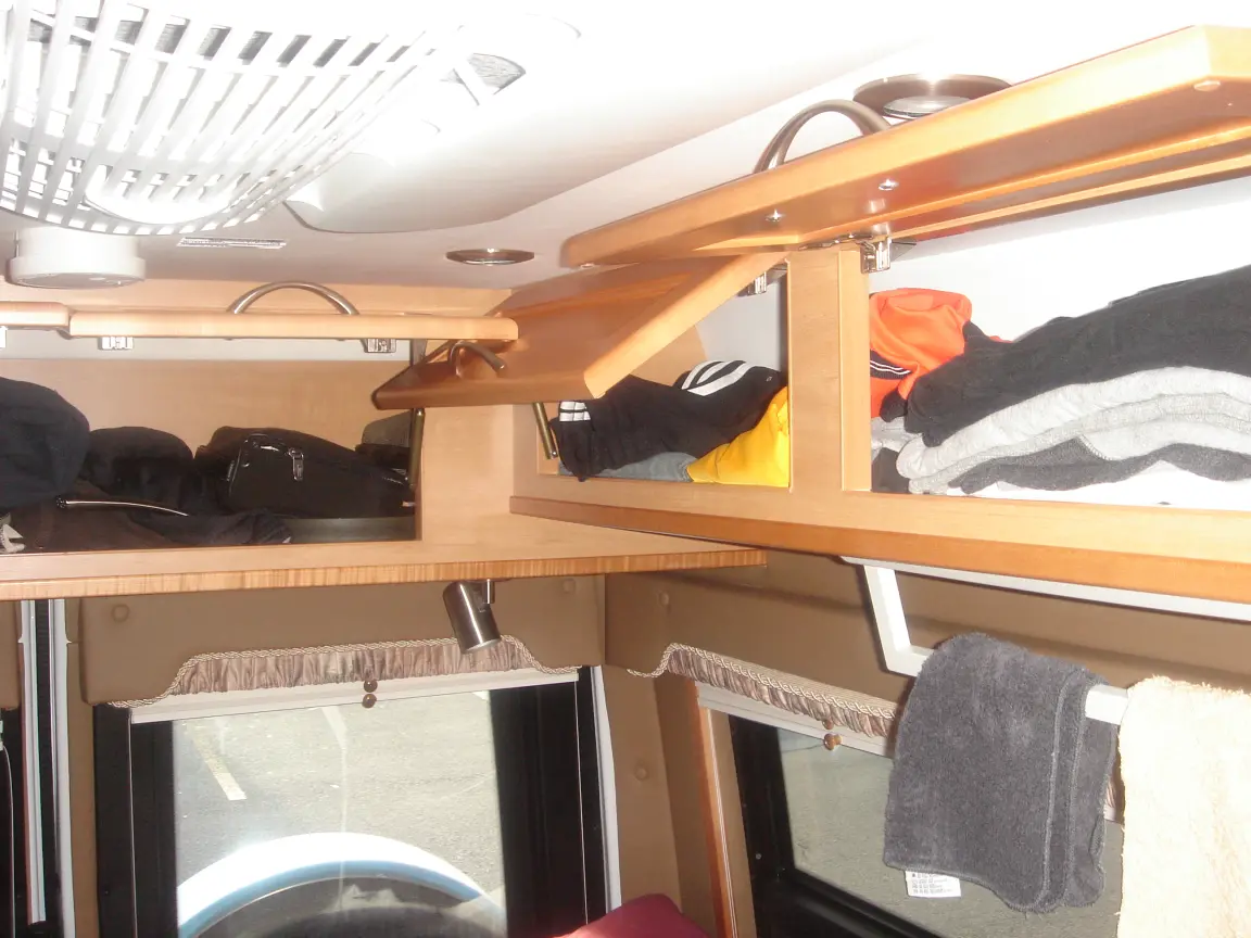 The van the day we brought it back: Simon's spot between the seats, the galley, the drawers, and every cabinet we learned to latch.