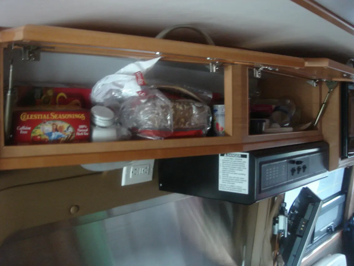 The van the day we brought it back: Simon's spot between the seats, the galley, the drawers, and every cabinet we learned to latch.
