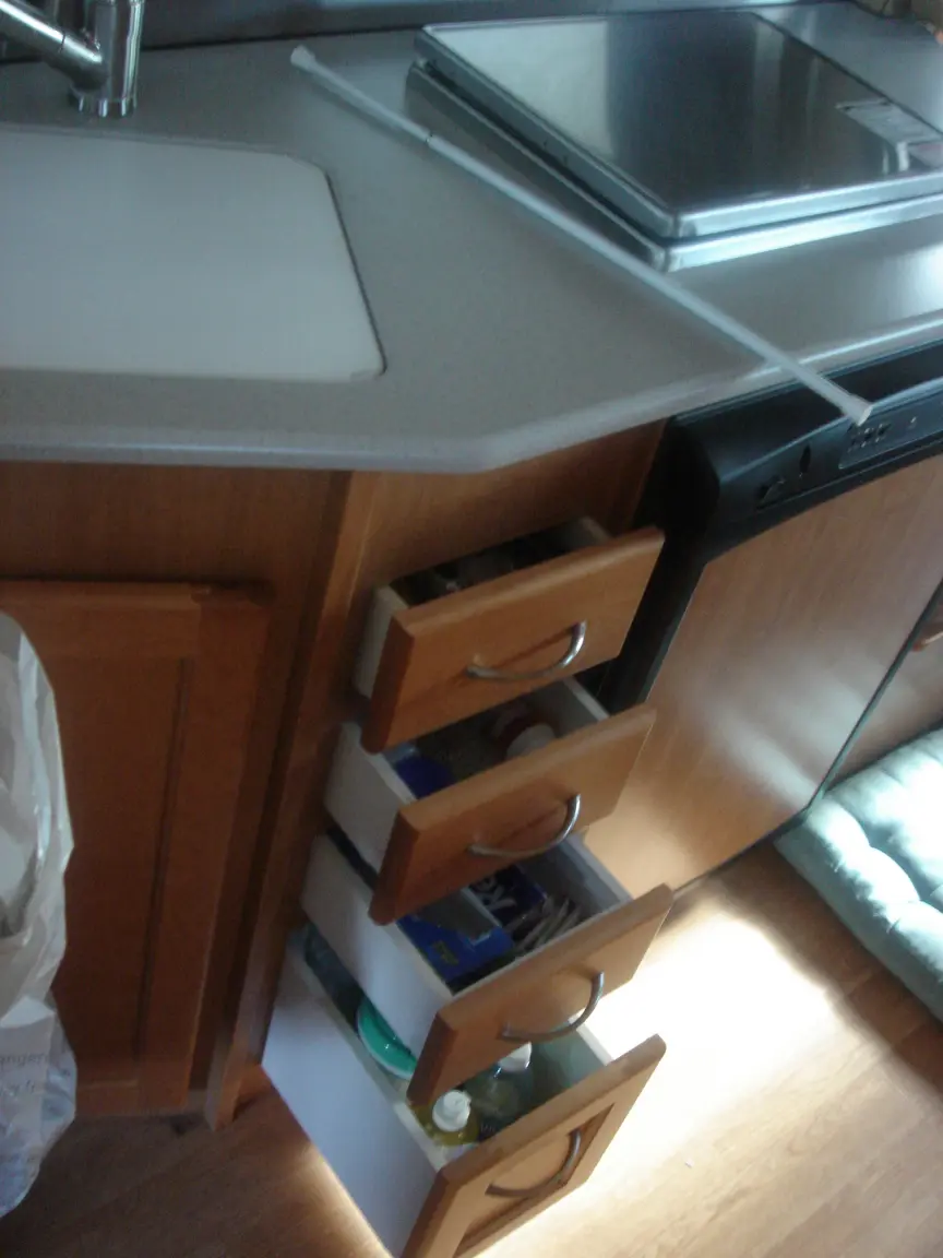 The van the day we brought it back: Simon's spot between the seats, the galley, the drawers, and every cabinet we learned to latch.