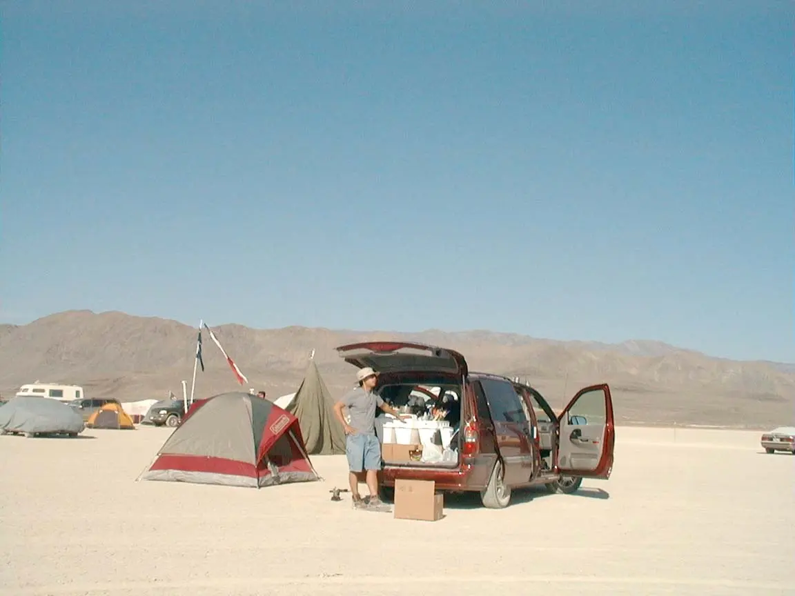 2002: unloading the minivan on open playa beside the Coleman tent